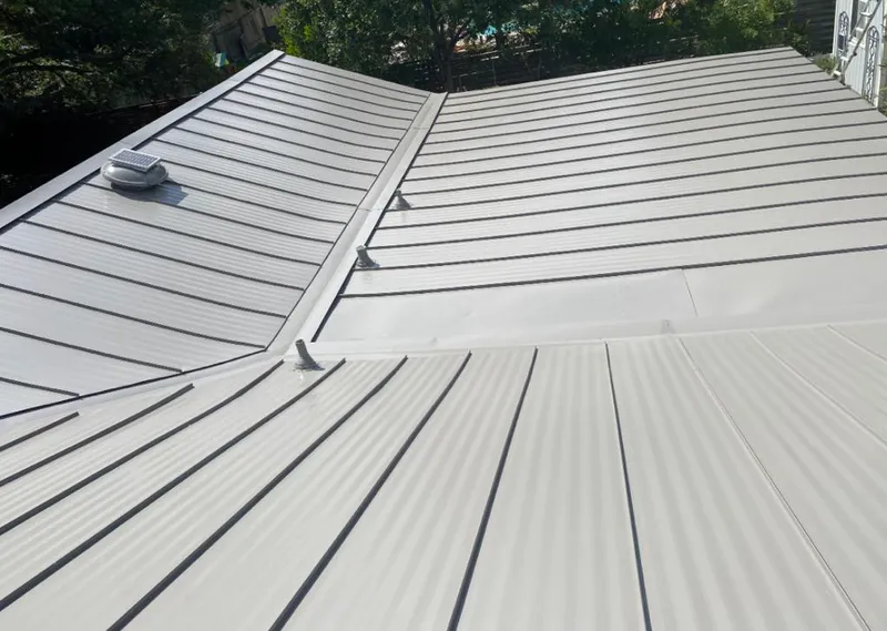 Solar attic fan installed on a metal roof for Roof Ventilation in Boulder Hill